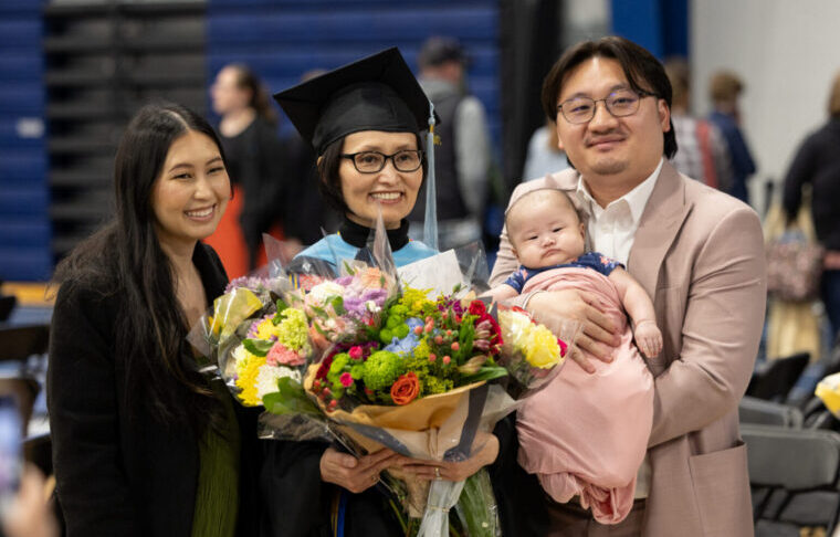 Family of four at a graduation ceremony
