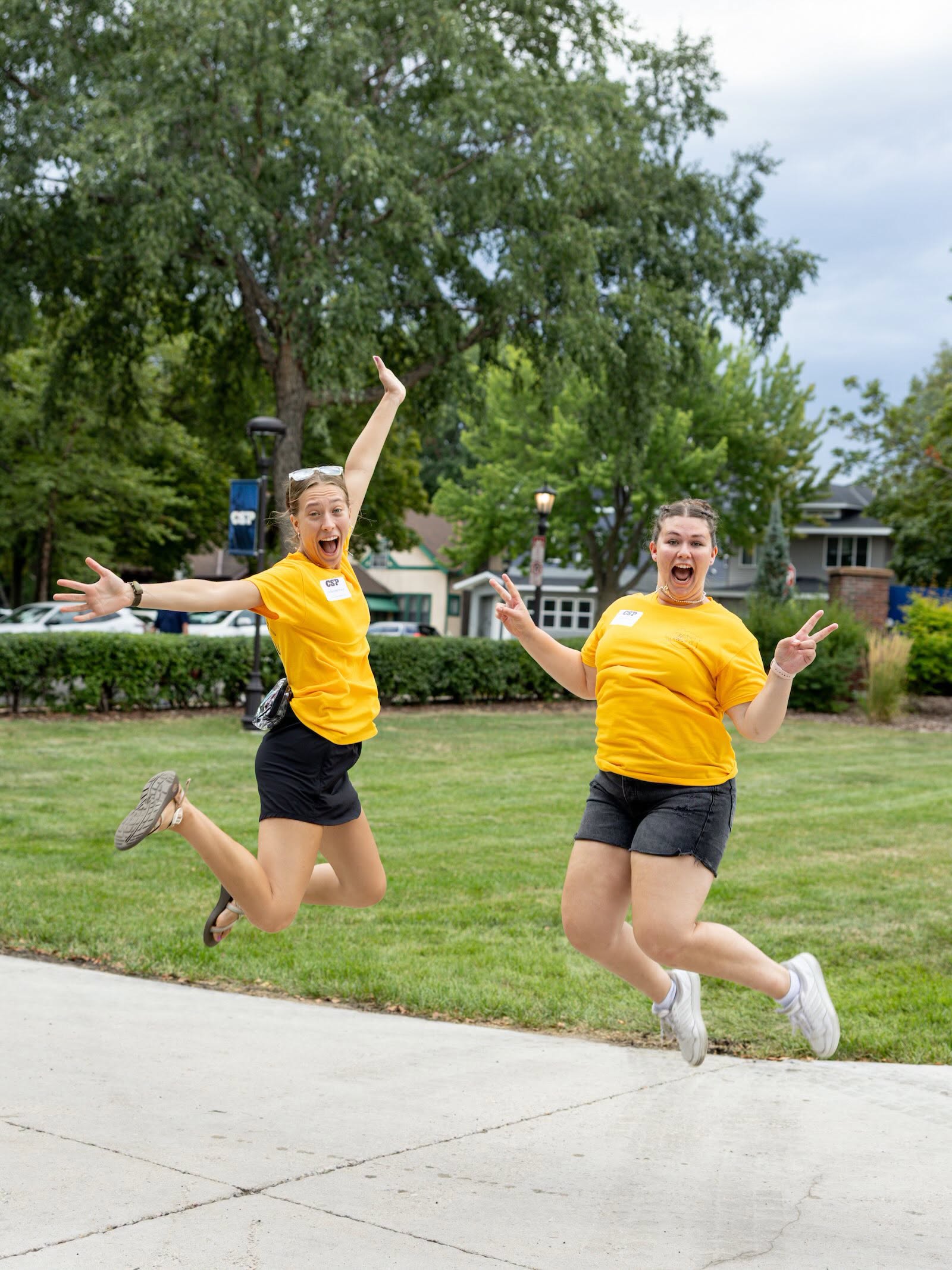 two students jumping for joy