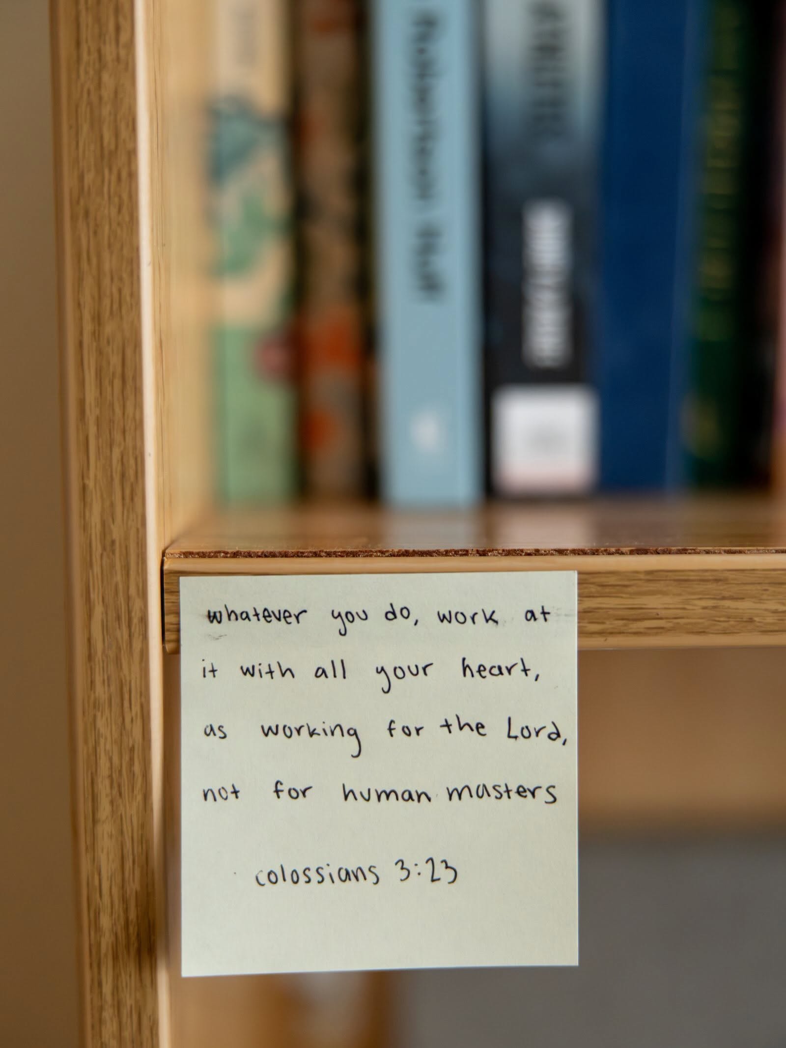 Bible verse on a students' book shelf