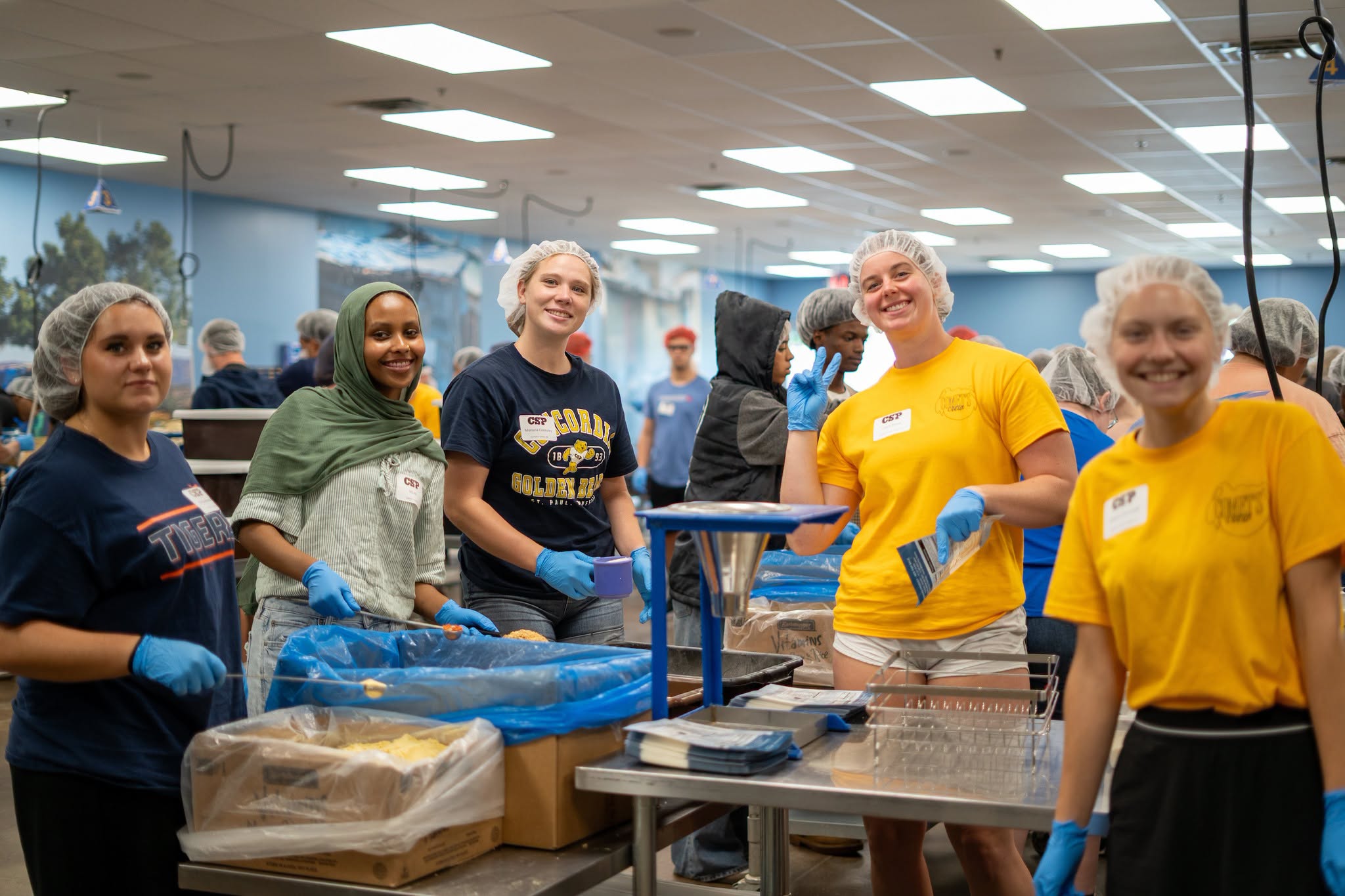 students working at Feed My Starving Children